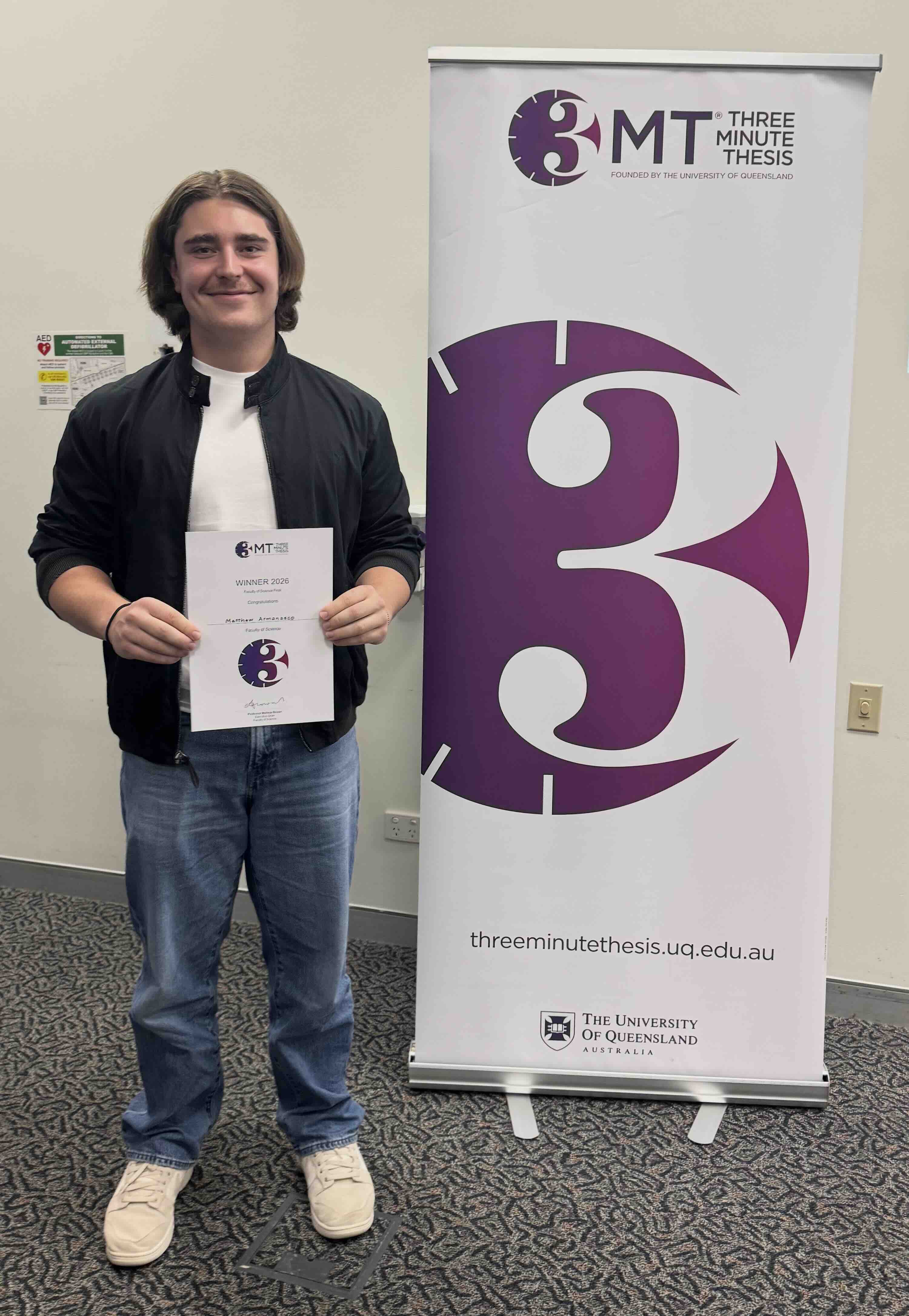 Matthew holding Faculty of Science 3MT Winner Certificate